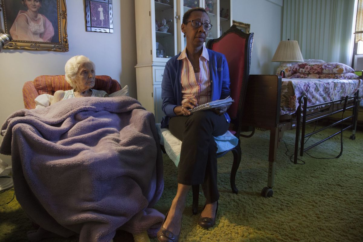 Heather sits with Florence, who was 100 years old when this photograph was taken. Whenever Heather enters a patient’s home for the ﬁrst time, she knows that she is walking into a long, long, complicated story that she understands nothing about, a story that is just then reaching its ﬁnal crisis.